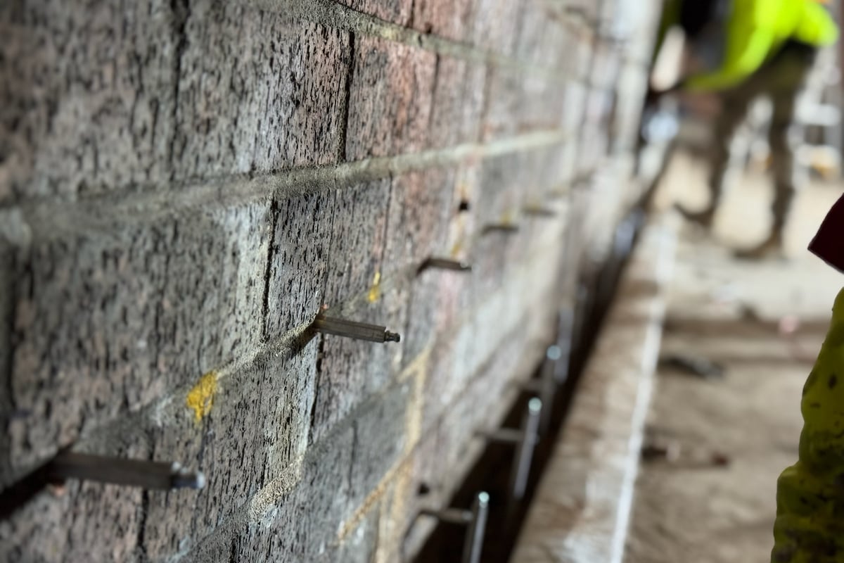 Thermal imaging moisture mapping identifying water infiltration points in curtain wall