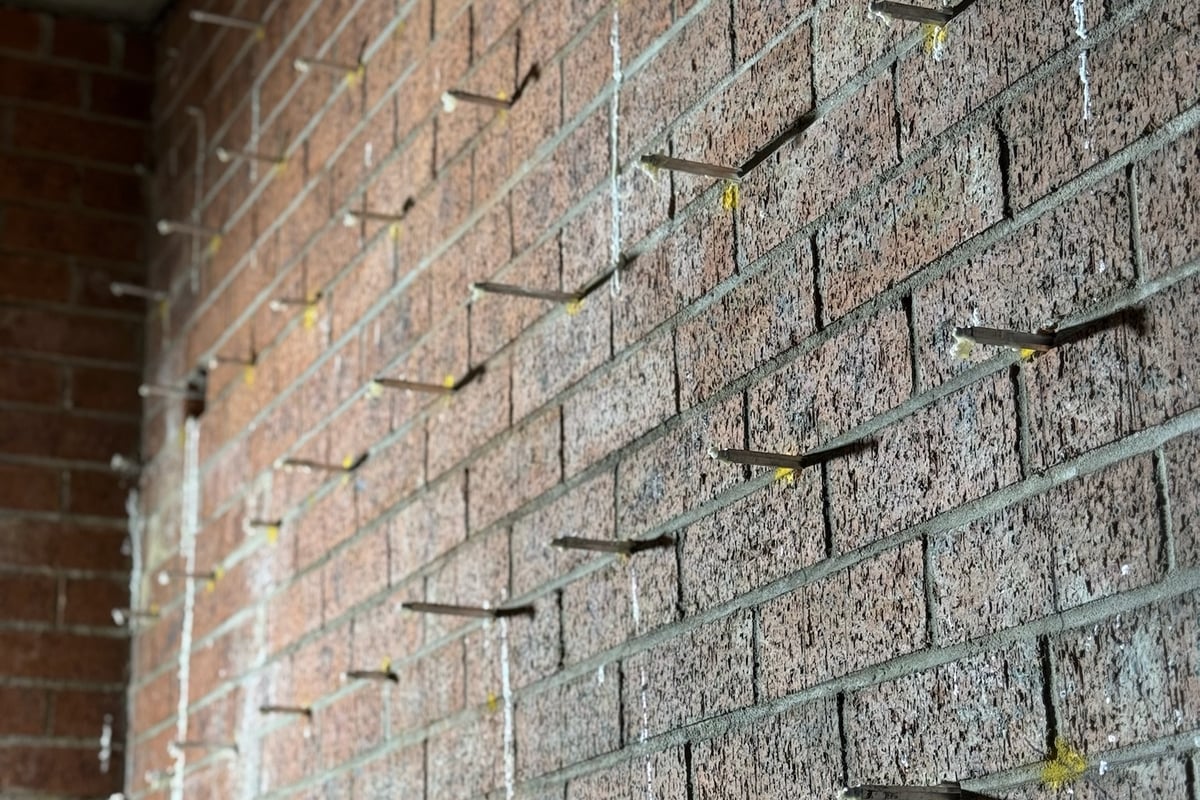 Water spray testing confirming 100% waterproofing effectiveness