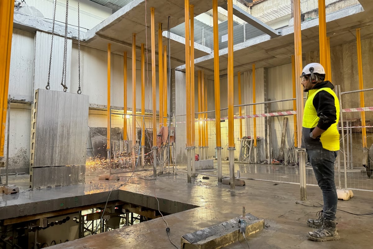 Custom steel beam installation creating new structural openings