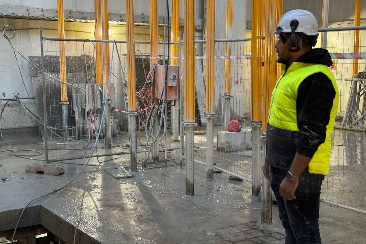 Custom steel beam fabrication and installation for load transfer