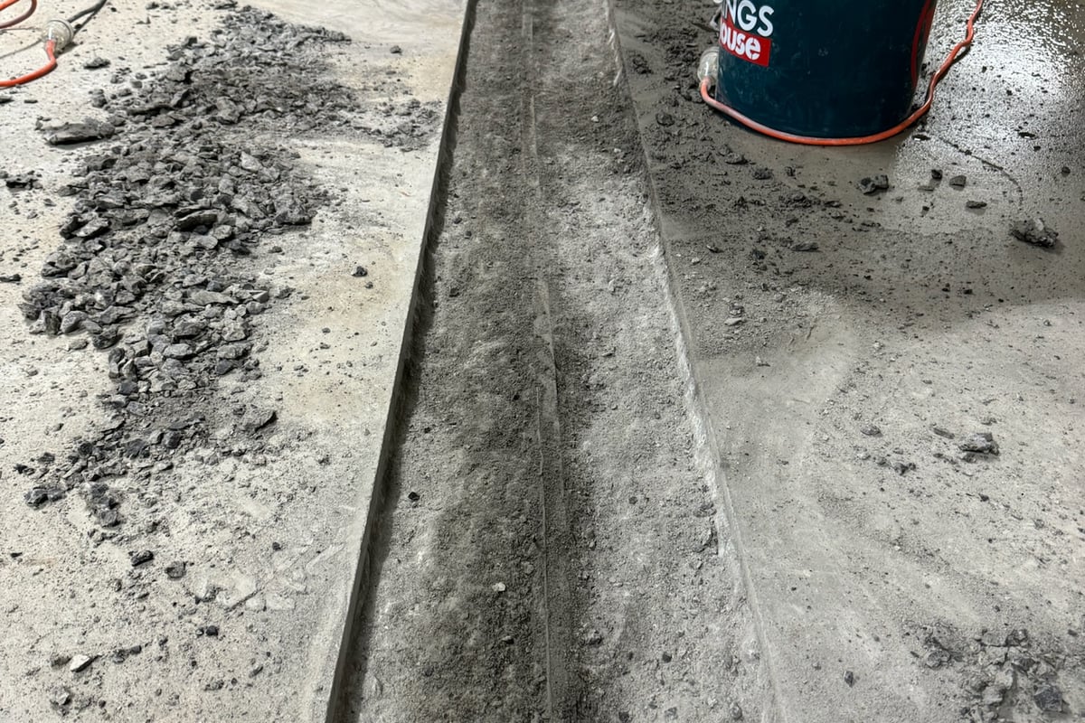 Complete removal of failed original sealant from construction joints