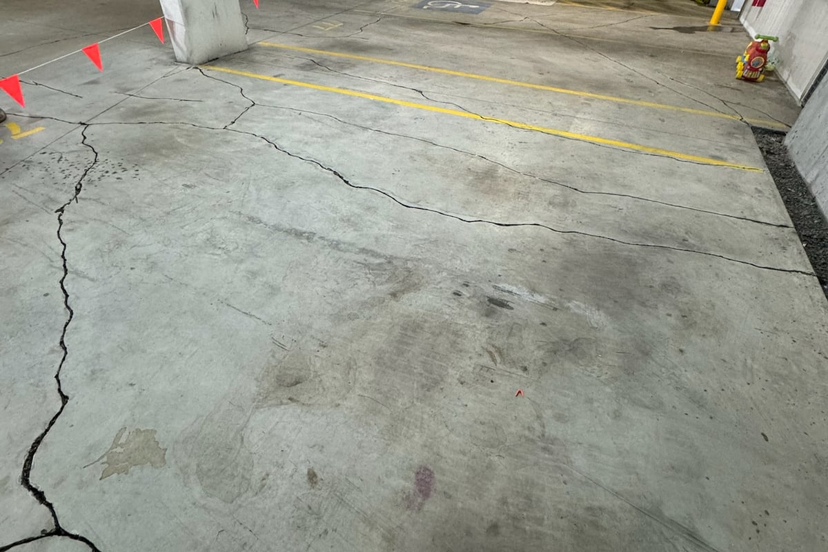 Structural steel member installation with certified welding in basement